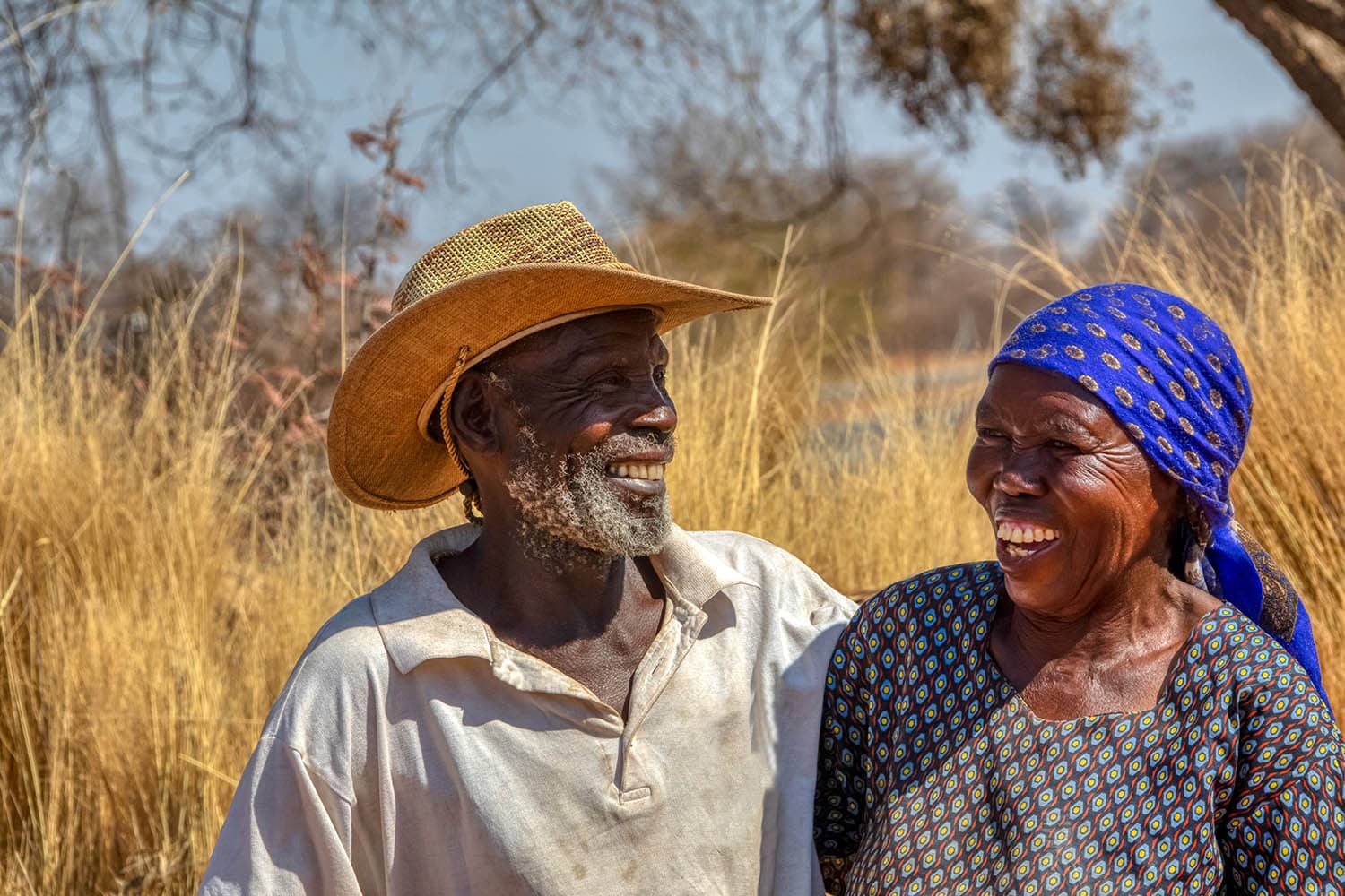 Older Black Man And Woman Smiling And Hugging