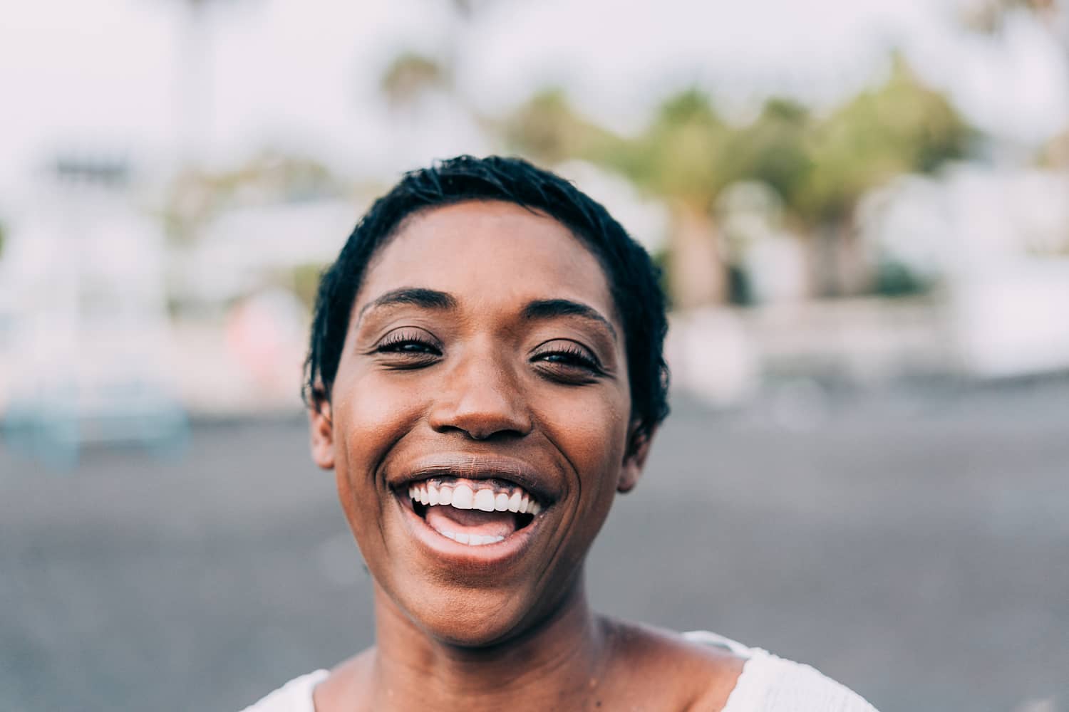 Black Woman Laughing Looking At The Camera