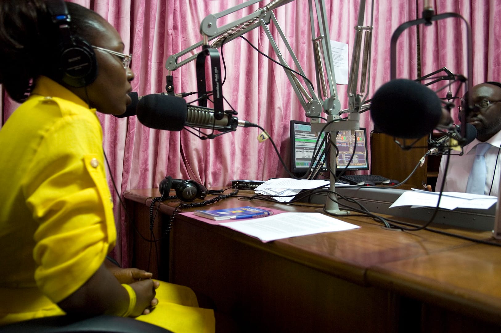 African Woman Speaking At A Radio Sound Booth