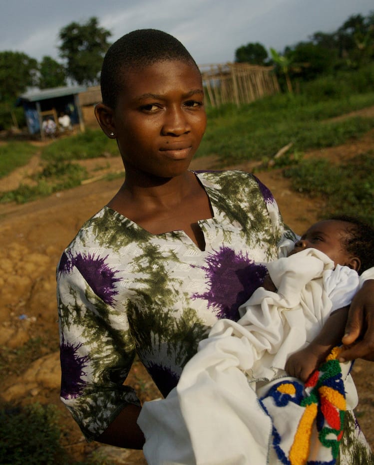 African woman holding her baby
