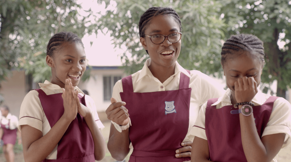 Three Black Students In Their Uniform Laughing